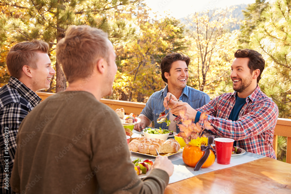 Group Of Gay Male Friends Enjoying Outdoor Meal Together Group Of Gay Male Friends Enjoying Outdoor Meal Together