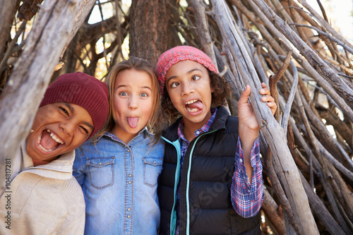 Tableau sur toile Group Of Children Playing In Forest Camp Together