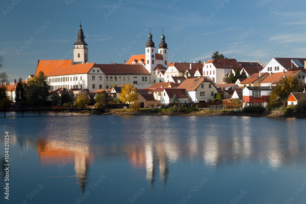Evening view of Telc or Teltsch town mirroring in lake Evening view of Telc or Teltsch town mirroring in lake