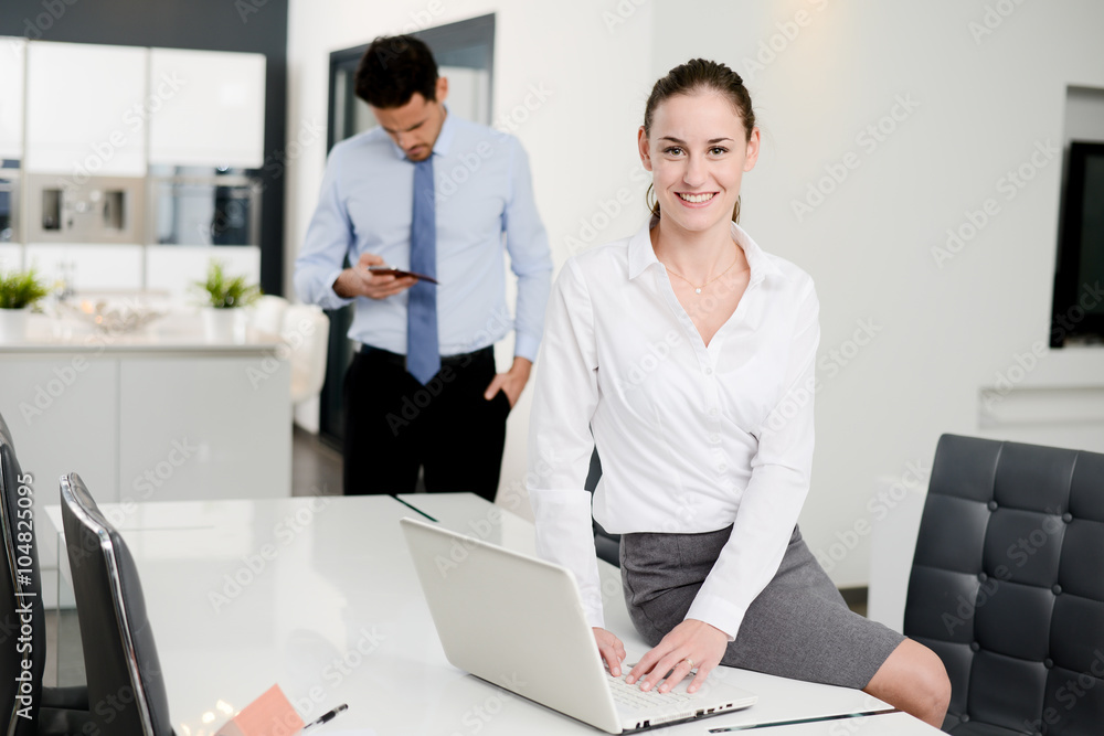 portrait of an attractive young business woman in office portrait of an attractive young business woman in office