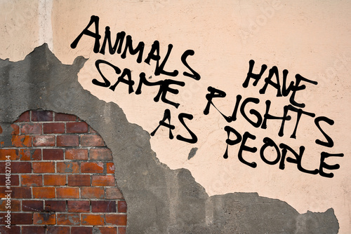 Handwritten graffiti Animals Have Same Rights As People sprayed on the wall, anarchist aesthetics  photo