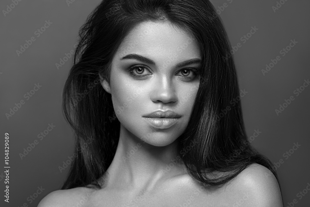 Beautiful Young Woman with shiny hair. The Black-and-white photo Beautiful Young Woman with shiny hair. The Black-and-white photo