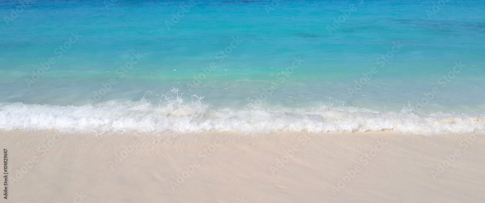Sea wave on white sand beach Sea wave on white sand beach