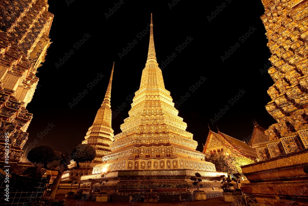 The 4 stupas of Wat Pho at night, Bangkok, Thailand