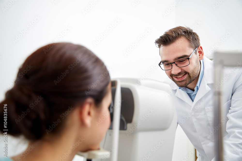Fototapeta premium optician with tonometer and patient at eye clinic
