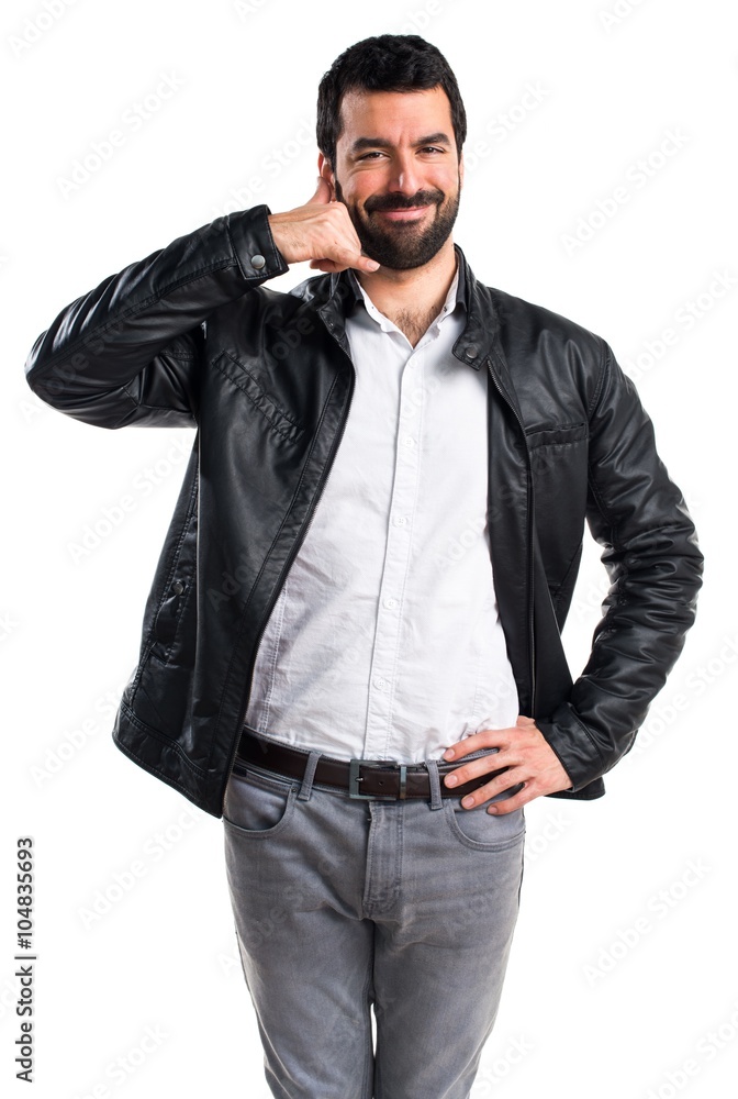Fototapeta premium Man with leather jacket making phone gesture