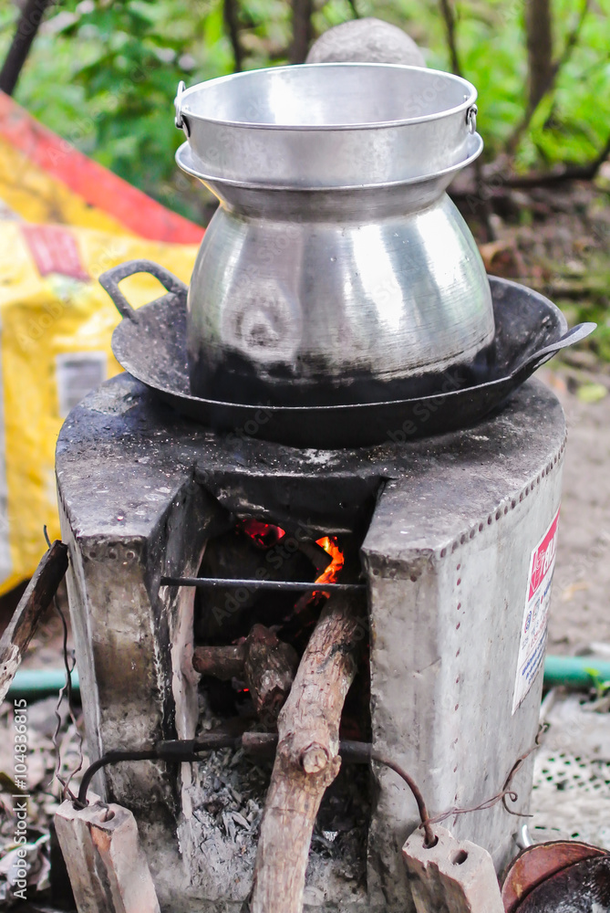 Tall pot with hole pan cooking on stoves Tall pot with hole pan cooking on stoves