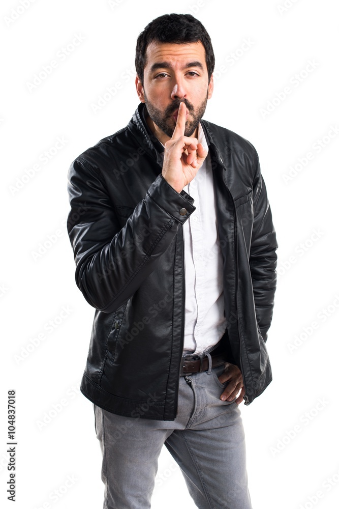 Man with leather jacket making silence gesture Man with leather jacket making silence gesture