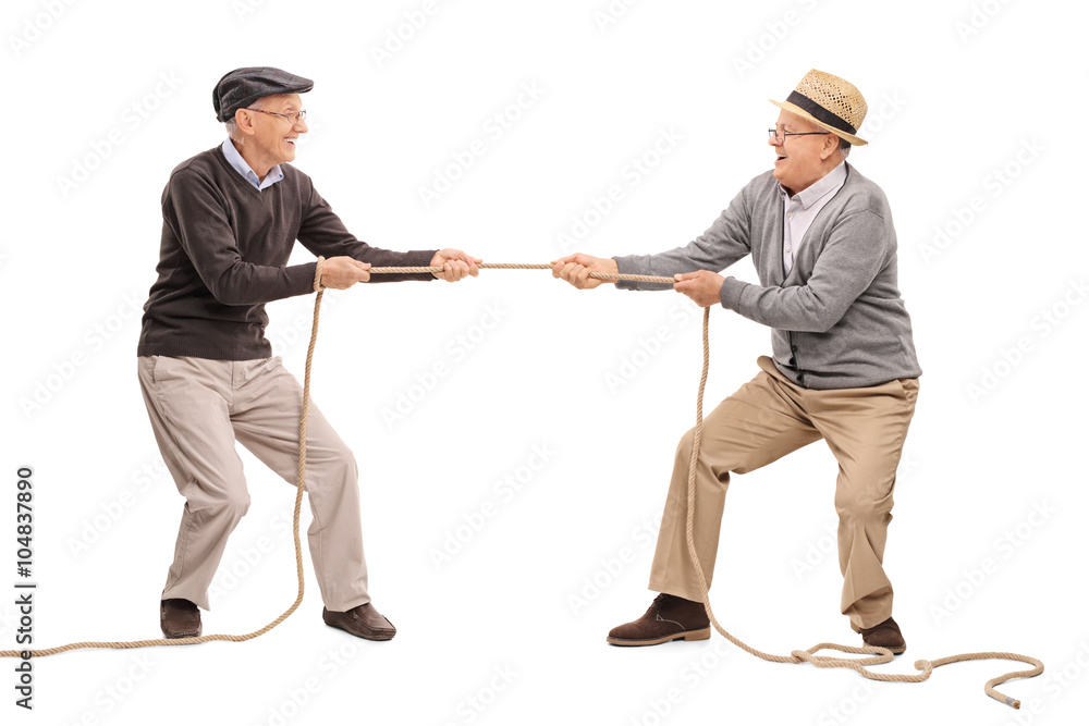 Two seniors competing in a tug of war Two seniors competing in a tug of war
