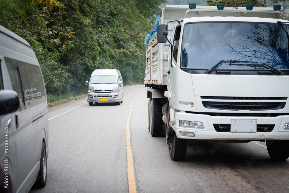 A van driving at high speeds, overtaking other cars