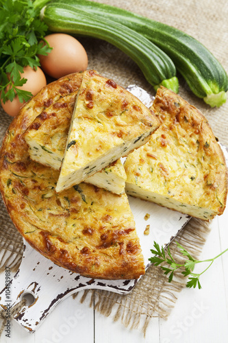 Zucchini pie with cheese and herbs