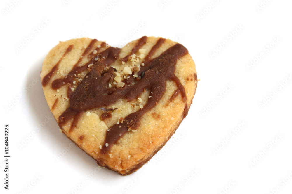 isolated heart shape cookie with chocolate and nuts with copy space