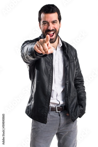 Man with leather jacket pointing to the front