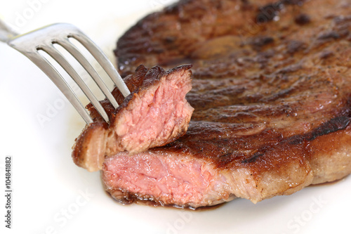 isolated served delicious piece of medium grilled beef steak on white background