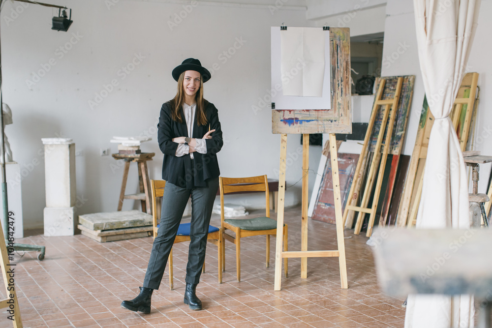 Woman painter working in the studio Woman painter working in the studio