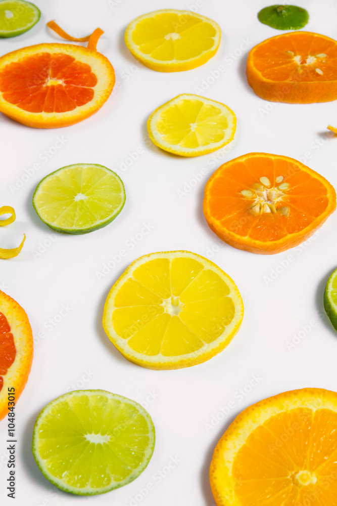 Bright colorful design of various citrus fruit slices with oranges, lemons, limes, grapefruit and tangerines. Bright colorful design of various citrus fruit slices with oranges, lemons, limes, grapefruit and tangerines.
