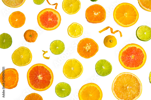 Bright colorful design of various citrus fruit slices with oranges, lemons, limes, grapefruit and tangerines. 