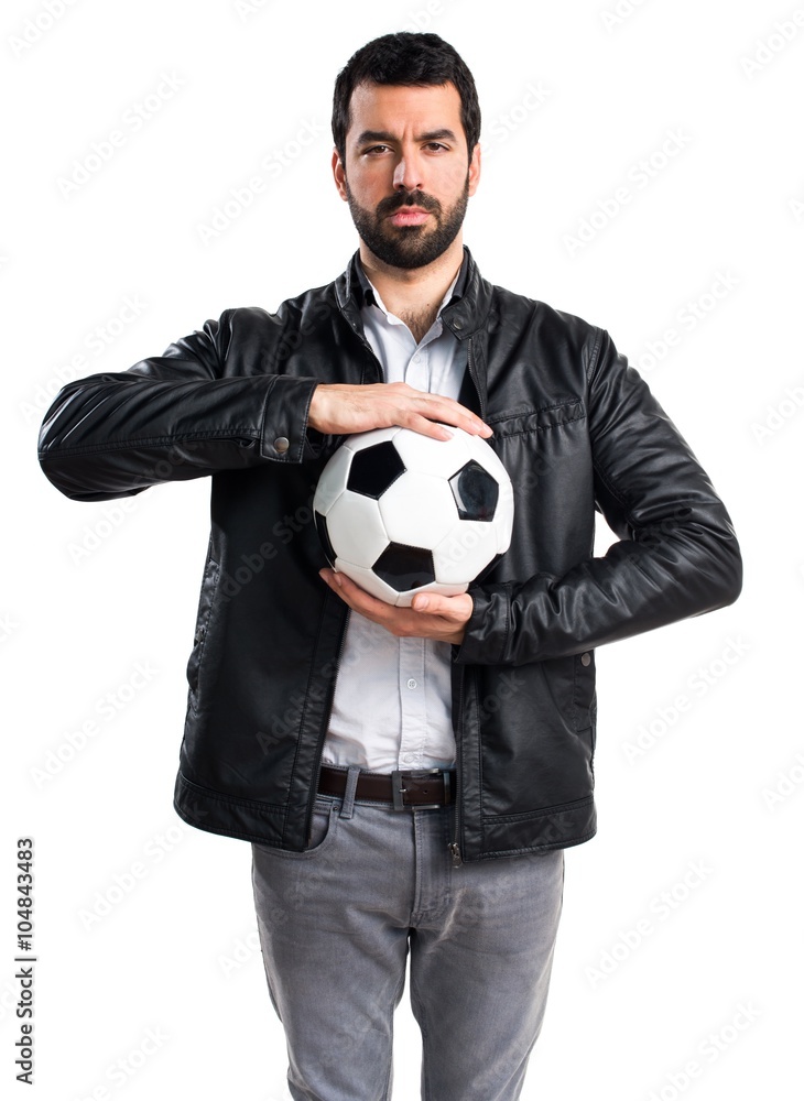 Man with leather jacket holding a soccer ball Man with leather jacket holding a soccer ball