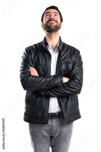 Man with leather jacket looking up