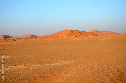 Sand dune hill on empty plane in desert Oman © maurusasdf