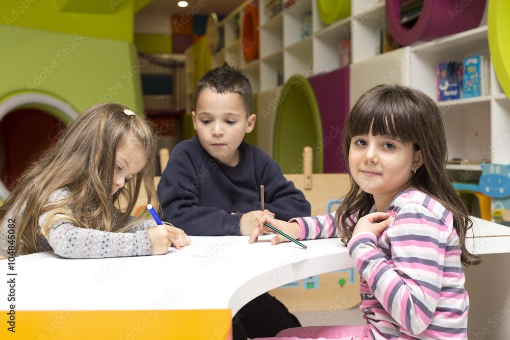 Children drawing at playroom Children drawing at playroom