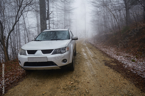 SUV offroad on a foggy day