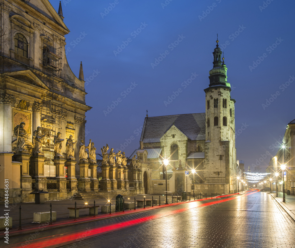 Fototapeta premium red cars trails on the street in Krakow in Poland