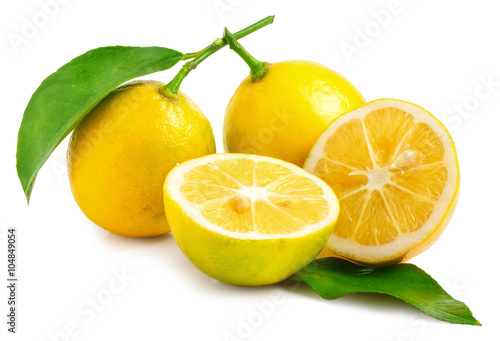 Two Lemons - one sliced in half on white background