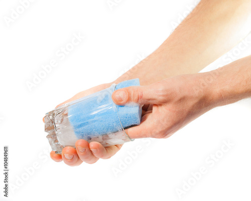 Man's hands washing dishes. On a white background