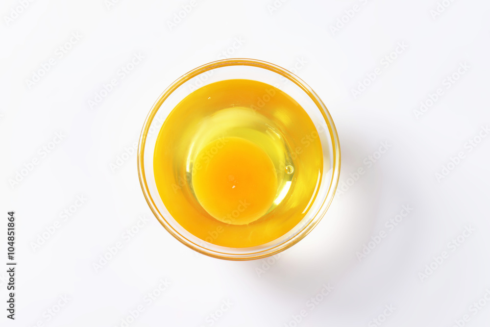 Egg white and yolk in glass bowl Egg white and yolk in glass bowl