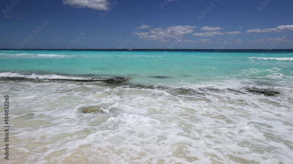 Surfing sea waves with foam on white tropical sandy beach
Surfing sea waves with foam on white tropical sandy beach