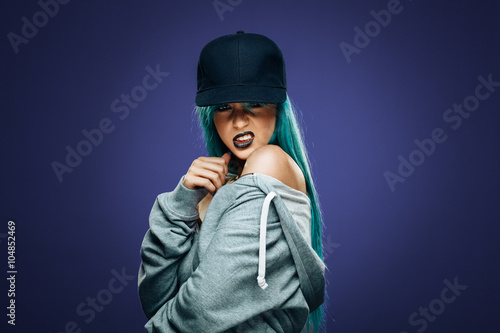 Sexy hip hop woman in hoodie and cap © djile