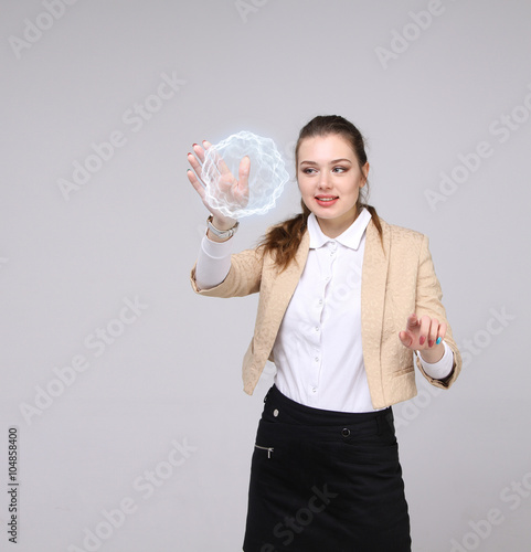 Woman with glowing magical energy ball. © Vasily Merkushev