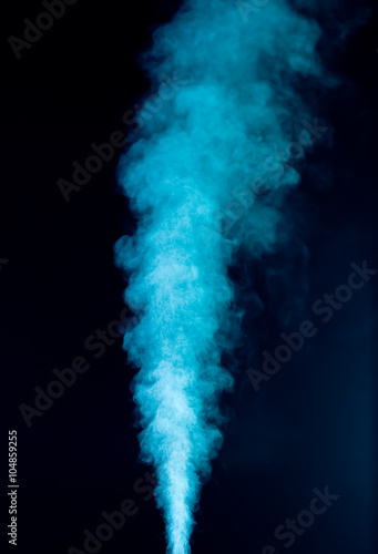 Blue vapor on the black background