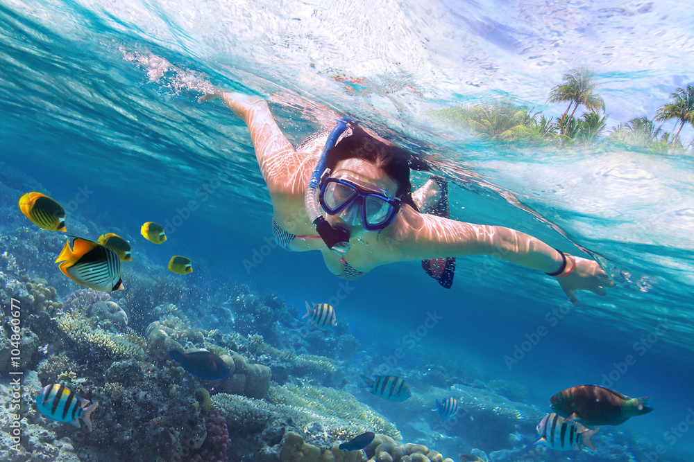 Beautiful women snorkeling in the tropical sea