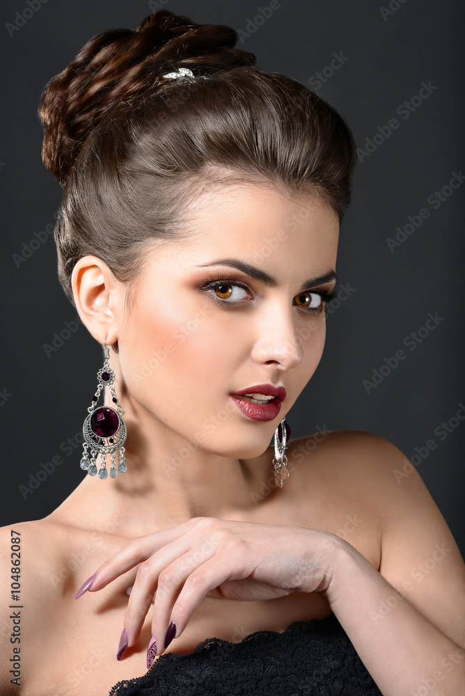 Beautiful brunette woman with evening make-up and perfect skin. Beauty face.