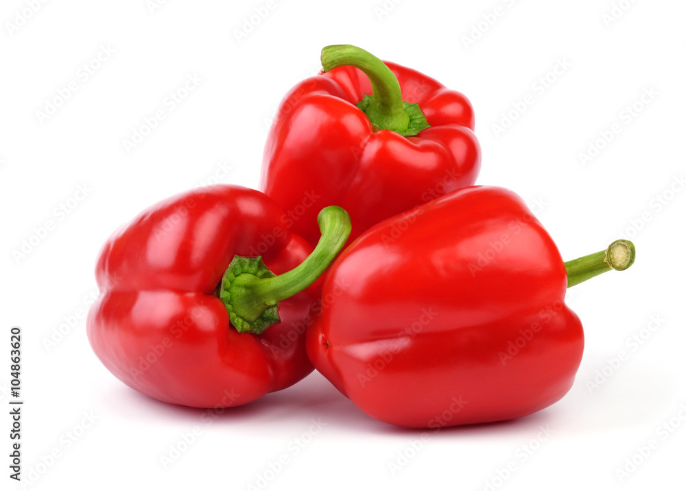 Three whole red sweet peppers isolated on white background.