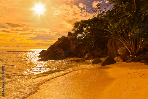 Seychelles tropical beach at sunset photo