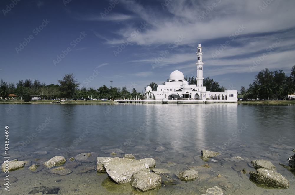 beautiful iconic  floating mosque at Terengganu, Malaysia with blue sky background. image taken . Copyspace to the left