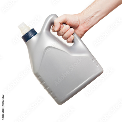 open gray machine oil canister in hand isolated on a white backg