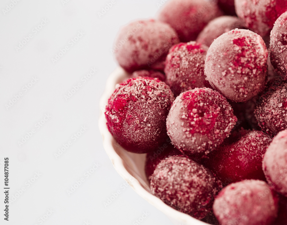 frozen cherries in the plate on white background frozen cherries in the plate on white background
