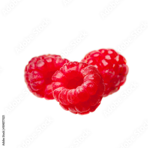 juicy red ripe raspberries isolated on white background