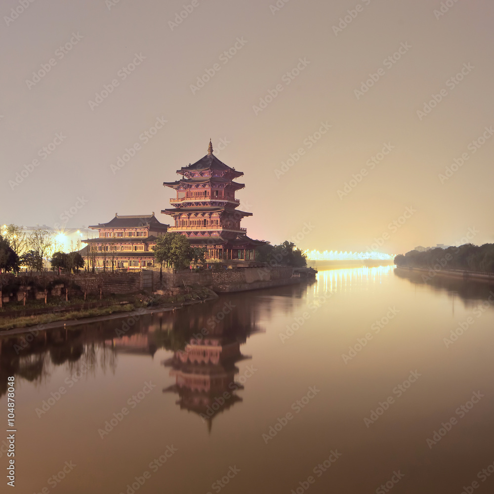 Ancient pagoda beside a quiet canal during twilight, Nanjing, China Ancient pagoda beside a quiet canal during twilight, Nanjing, China