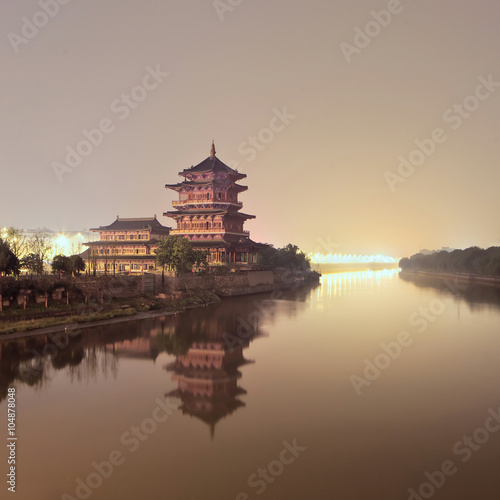 Ancient pagoda beside a quiet canal during twilight, Nanjing, China © tonyv3112
