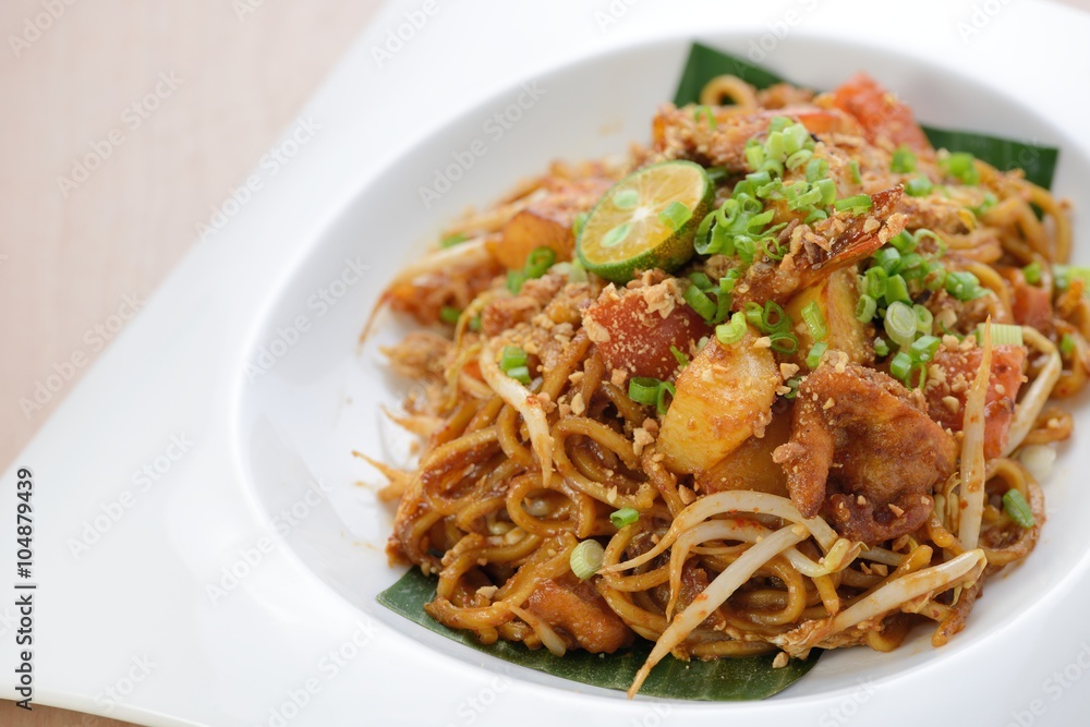 Indian style spicy fried noodles, ready to serve on dining table. Indian style spicy fried noodles, ready to serve on dining table.