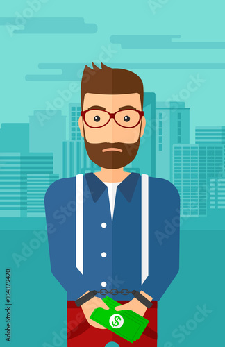 Man handcuffed for crime.