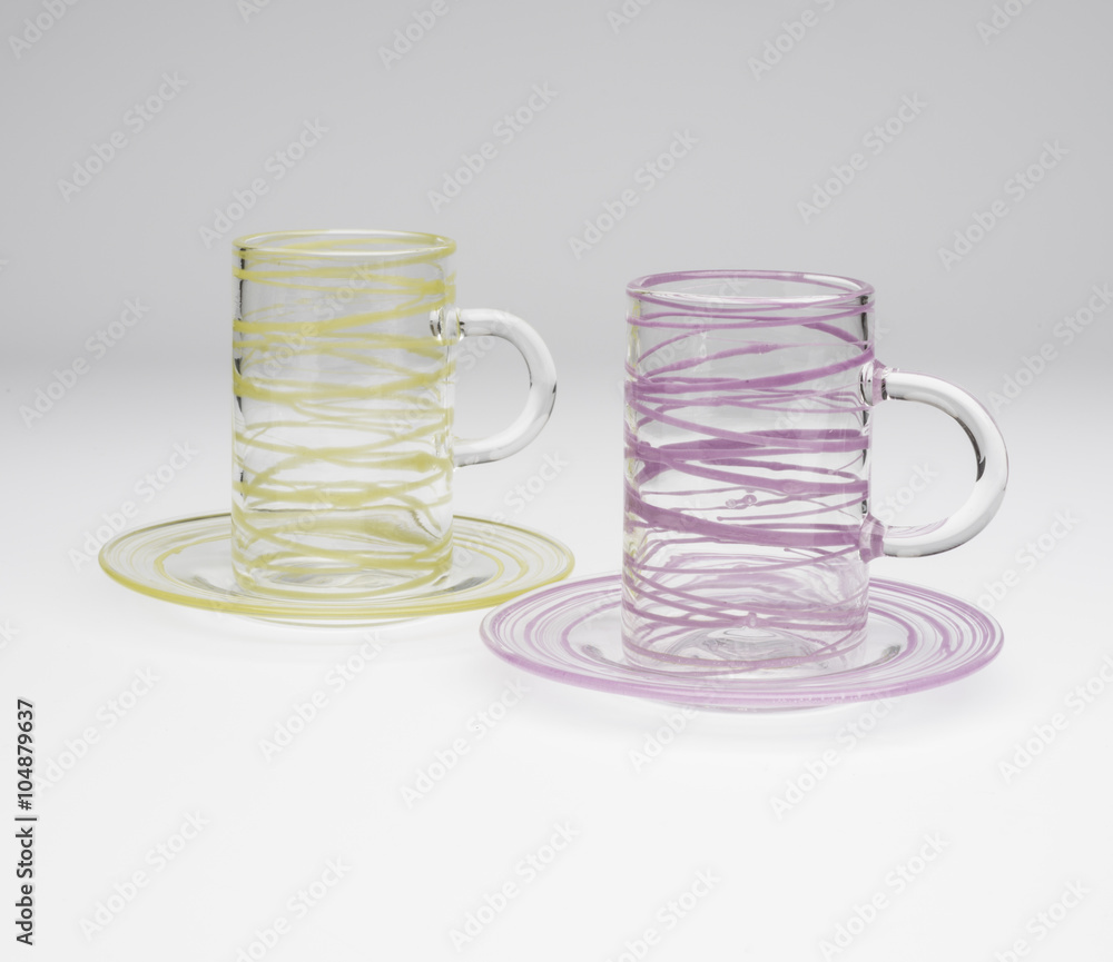 Fototapeta premium Pair of Slim Crystal Mugs on Matching Saucers