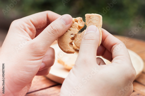 Woman's hand holding  cashew cookies