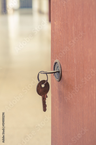 Closeup old keyhole with key © jat306