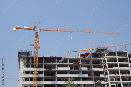 Crane under construction building